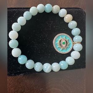 NWOT natural gem stone stretch bracelet with evil eye charm. Aqua and gold.